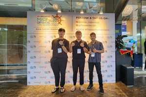 Posing at the entrance of the IMOX Exhibit Hall, Radisson Convention Center, Batam, Indonesia from left to right: Jayden Lee (BD Manager), Kayne Kim (COO), and Nico Rivera (Global BD Manager)